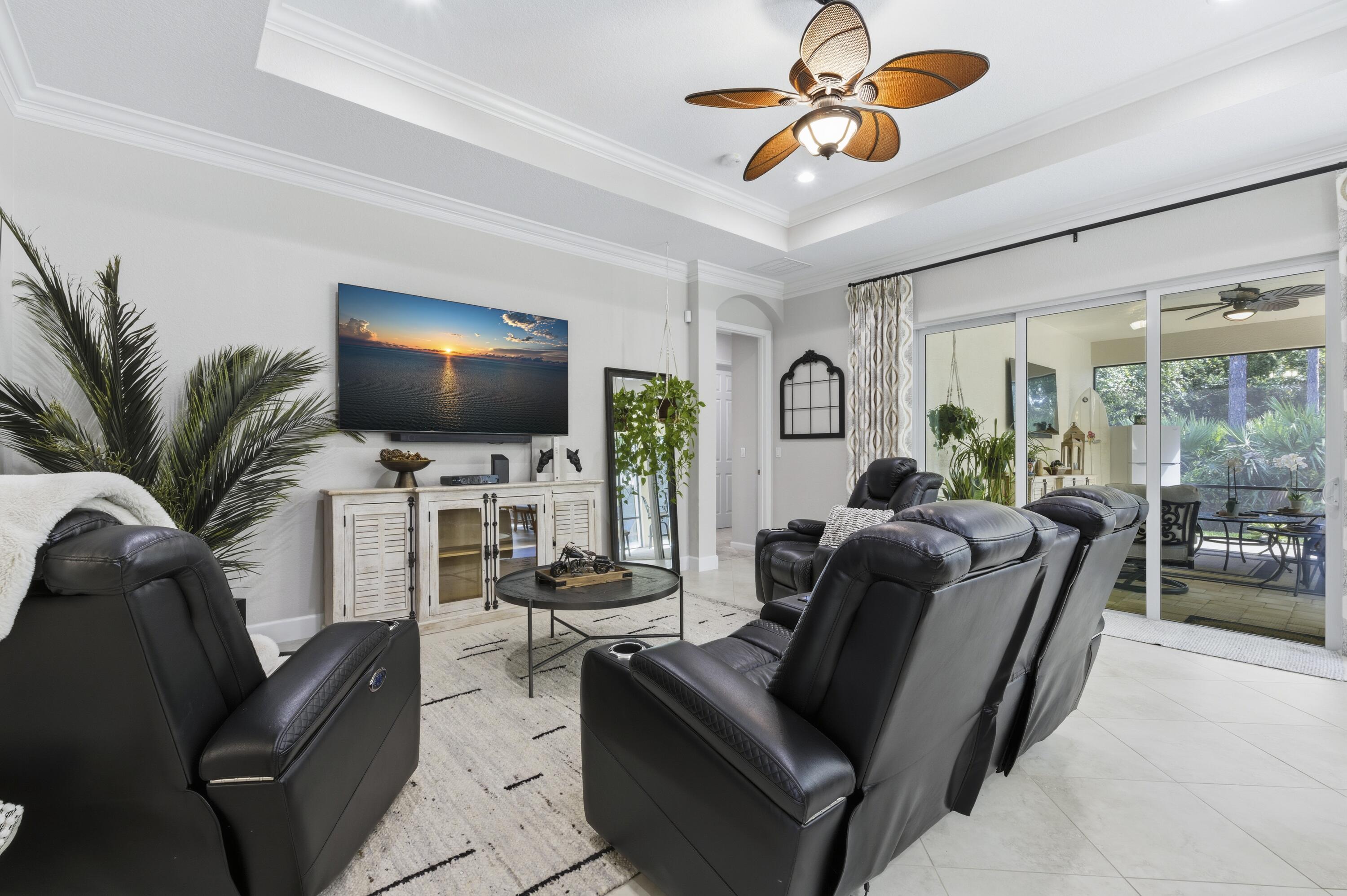 1016 Southwest Triste Way Stuart, FL 34997 - Photo 13 of 41 a living room with furniture and a flat screen tv
