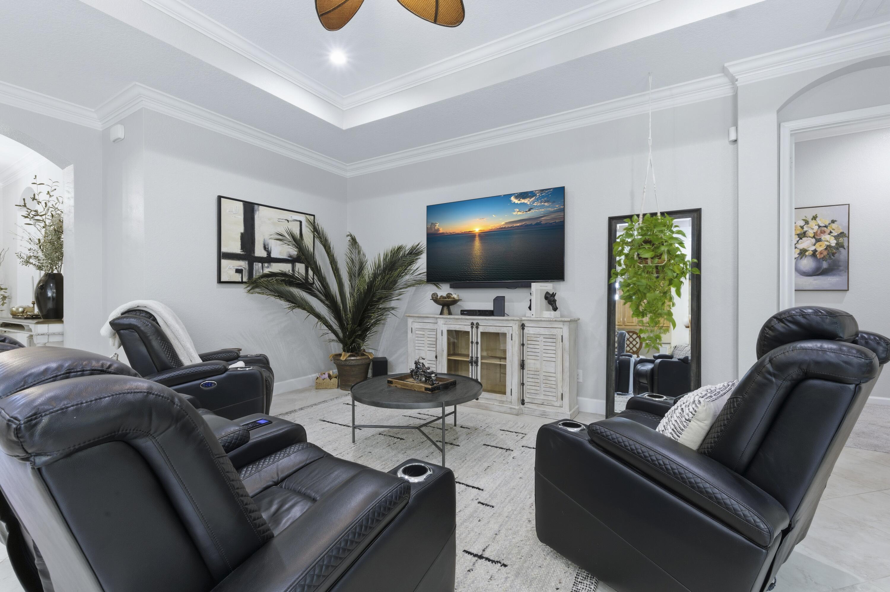 1016 Southwest Triste Way Stuart, FL 34997 - Photo 14 of 41 a living room with furniture and a flat screen tv