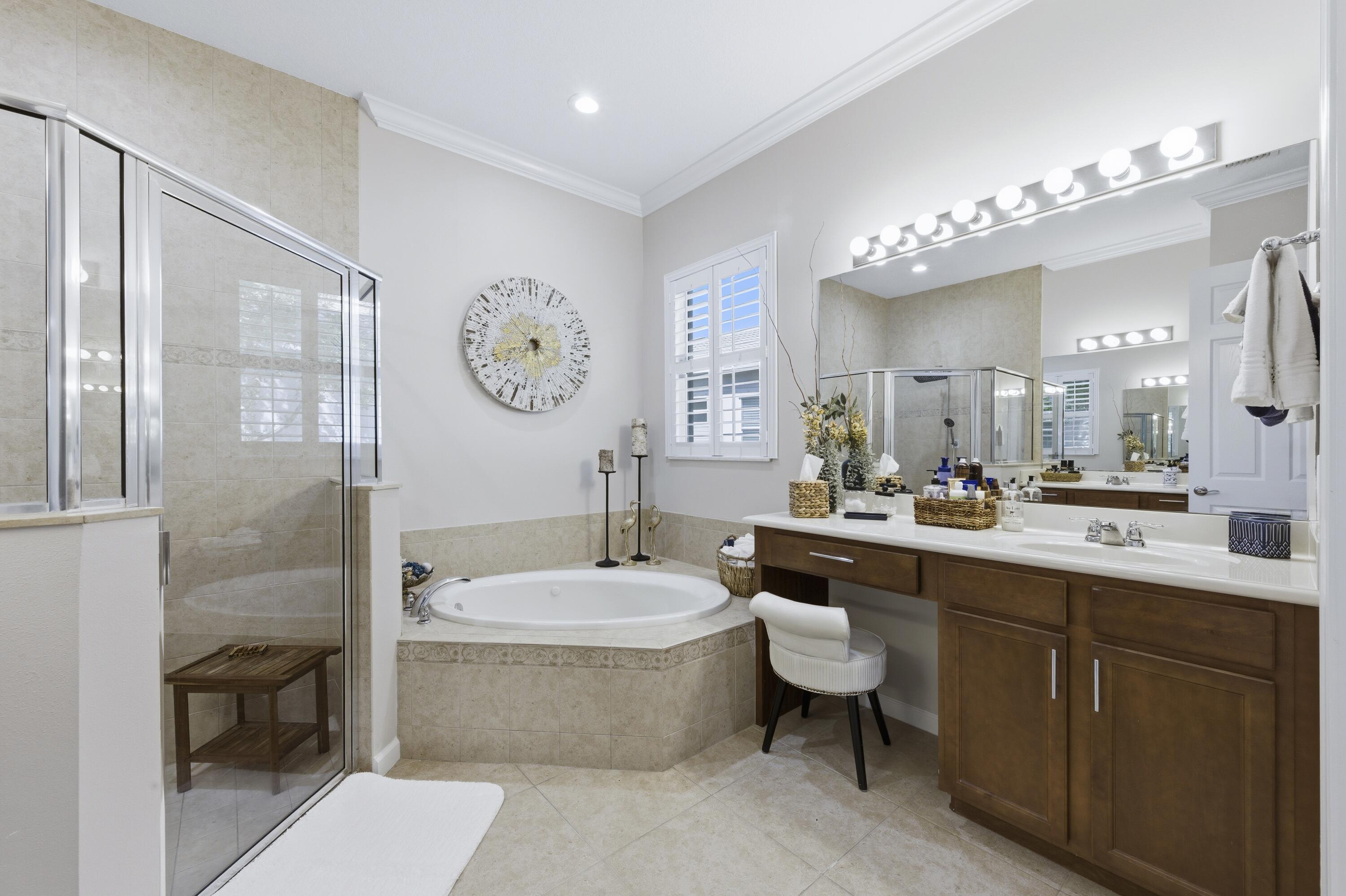 1016 Southwest Triste Way Stuart, FL 34997 - Photo 18 of 41 a large spacious bathroom with a double vanity sink mirror and toilet