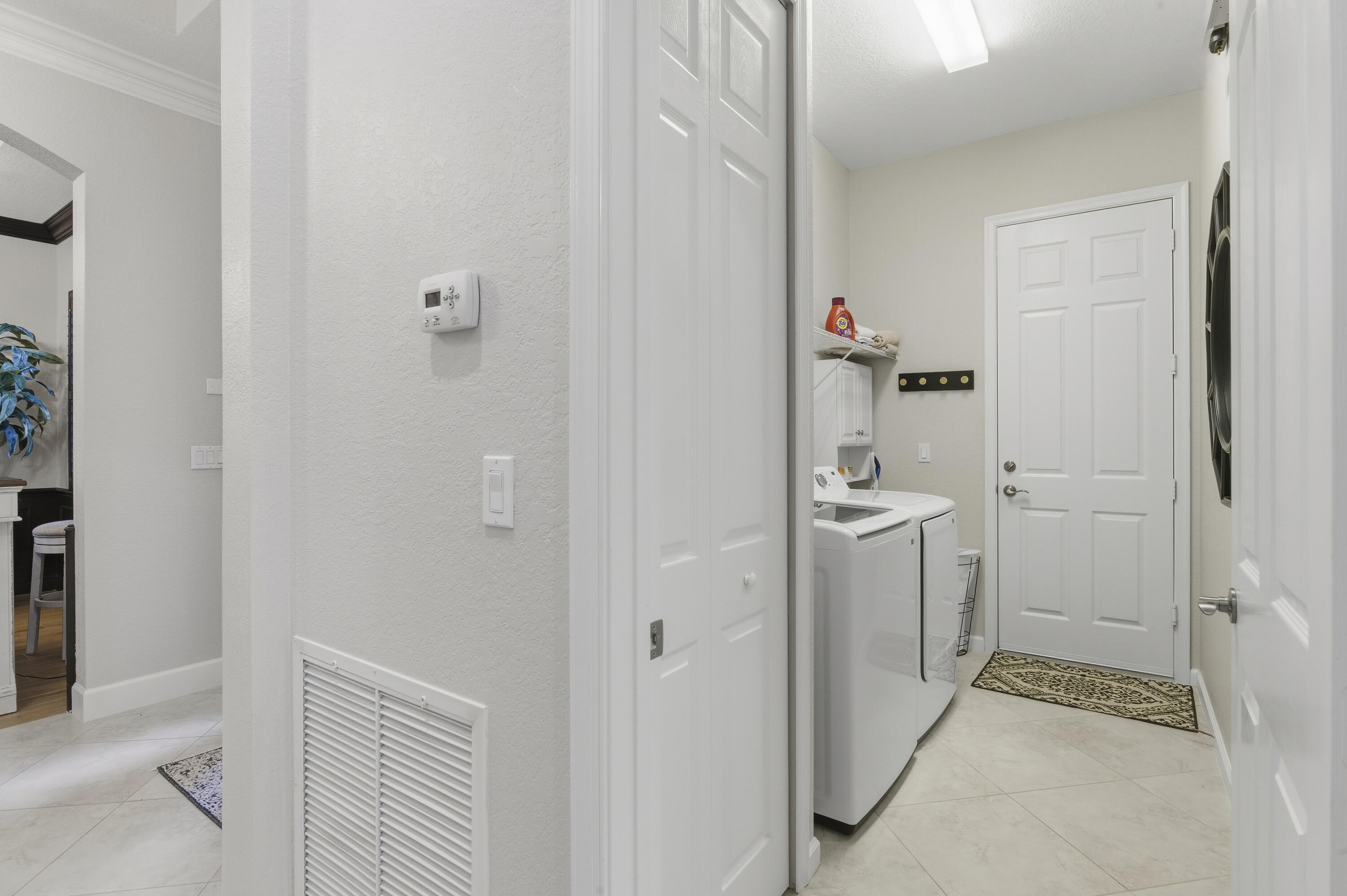 1016 Southwest Triste Way Stuart, FL 34997 - Photo 25 of 41 a bathroom with a sink and mirror