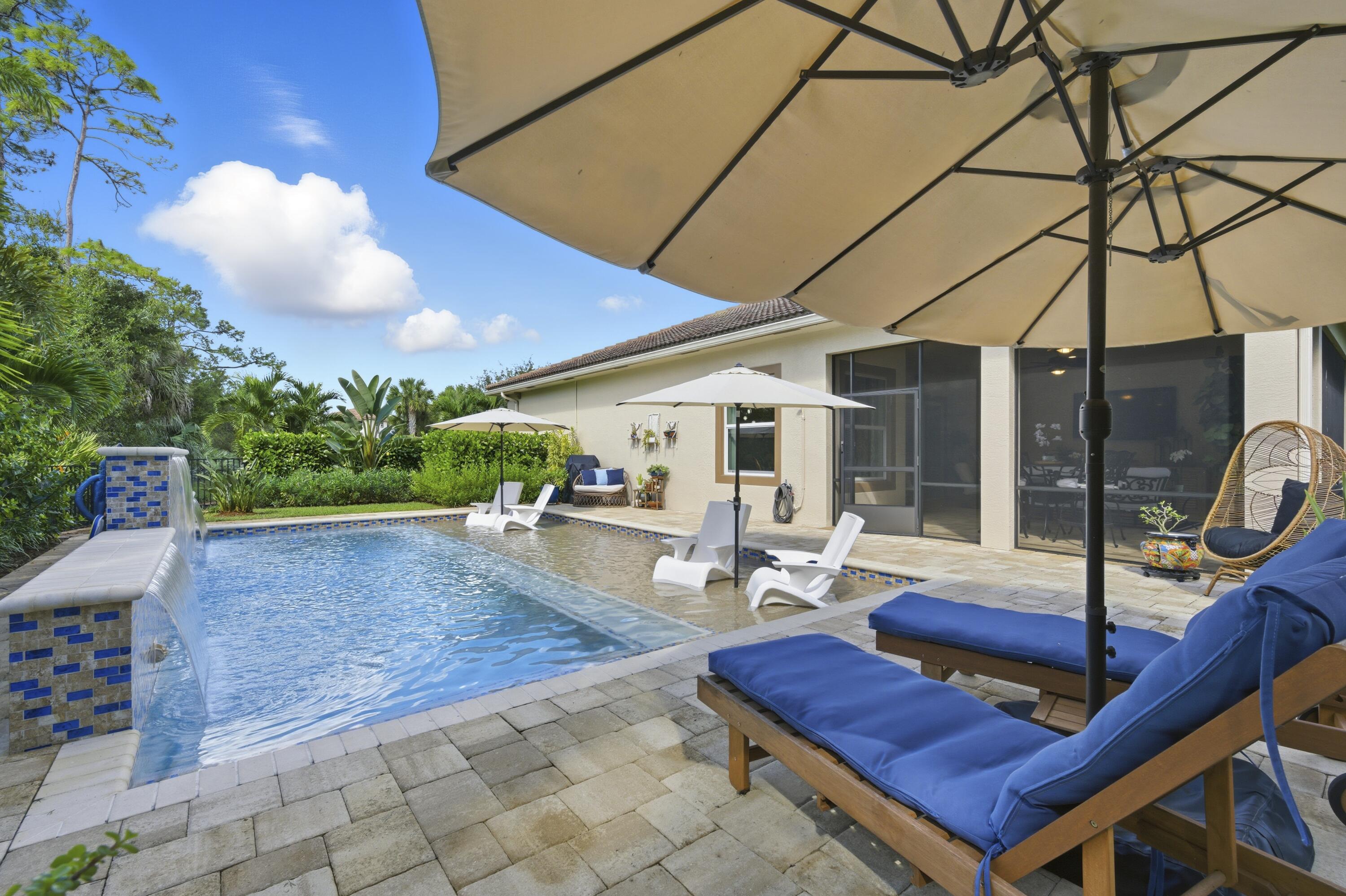 1016 Southwest Triste Way Stuart, FL 34997 - Photo 30 of 41 a outdoor space with lots of white furniture and garden