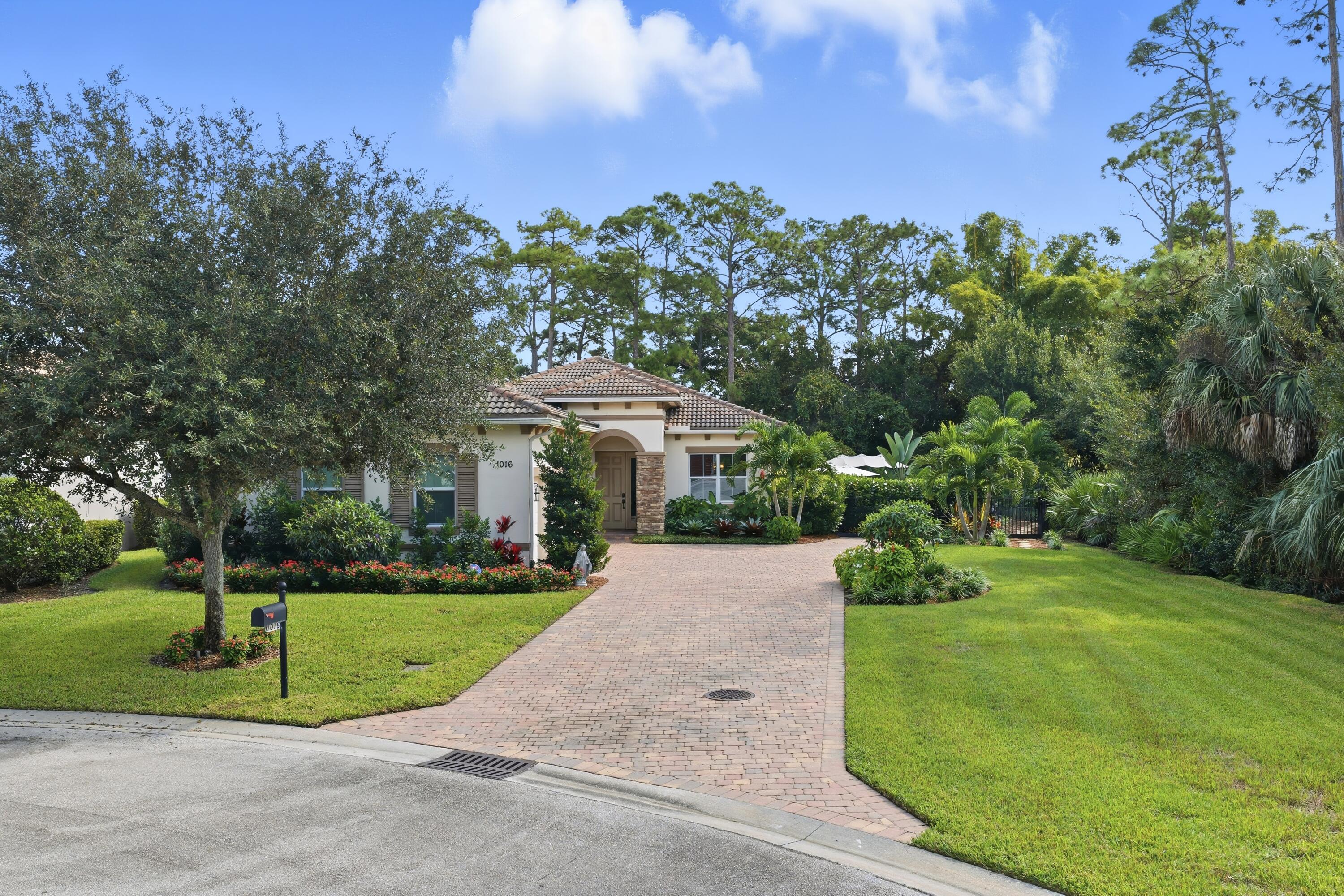 1016 Southwest Triste Way Stuart, FL 34997 - Photo 34 of 41 a view of a house with a yard
