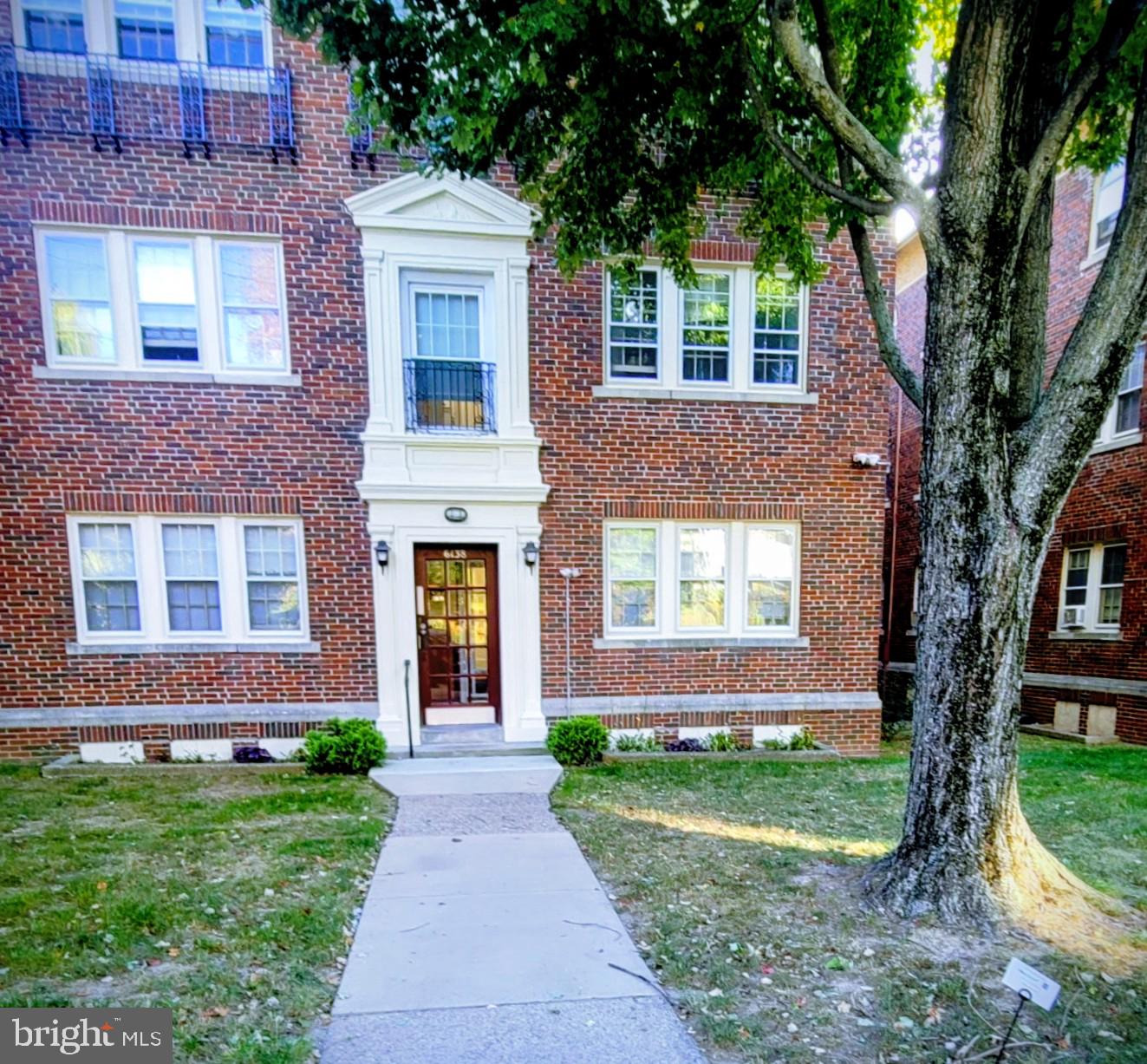 6138 Wayne Avenue, Unit 2 Philadelphia, PA 19144 - Photo 22 of 22 a front view of a house with garden
