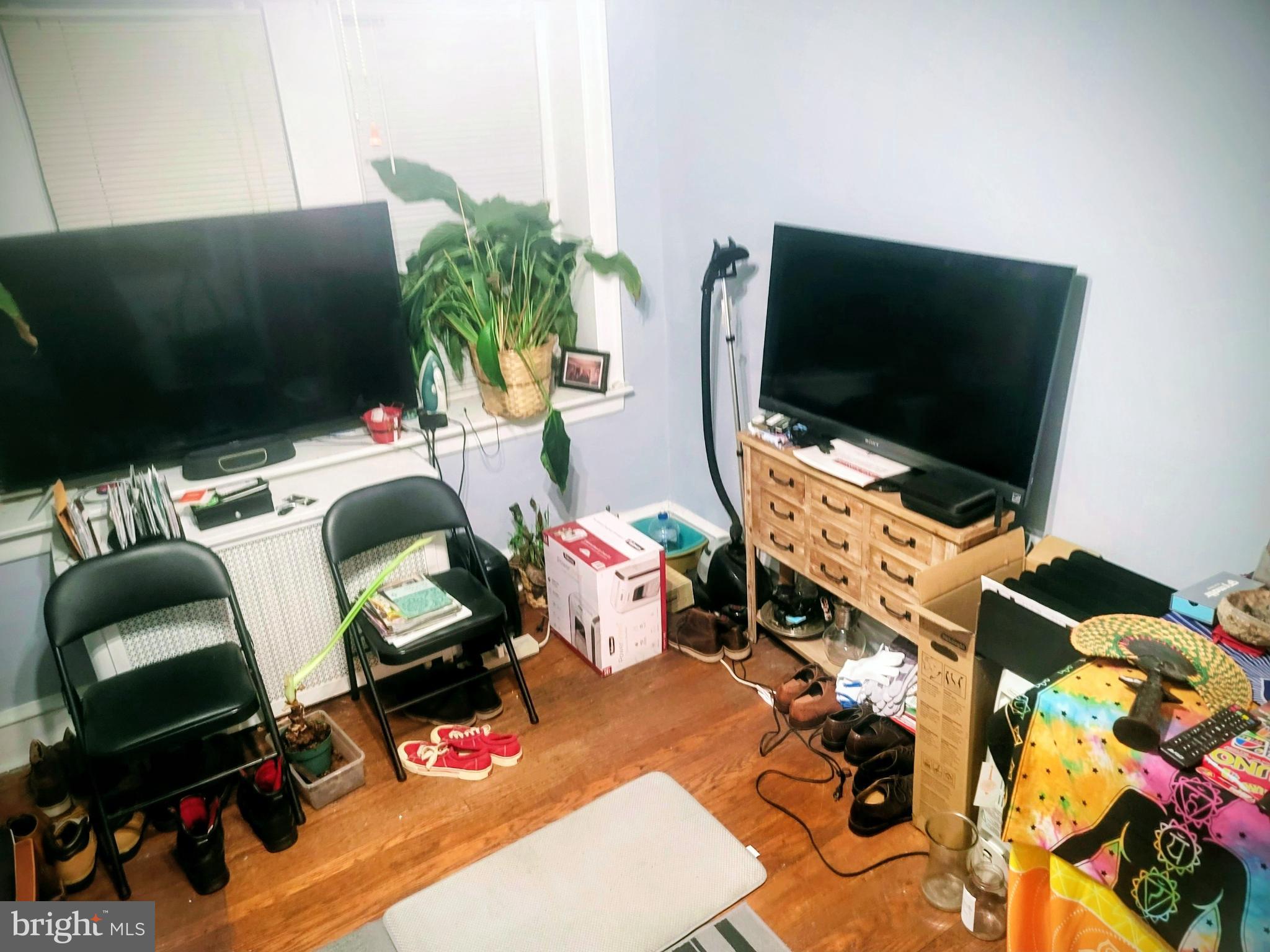 6138 Wayne Avenue, Unit 2 Philadelphia, PA 19144 - Photo 4 of 22 a room with furniture and a flat screen tv