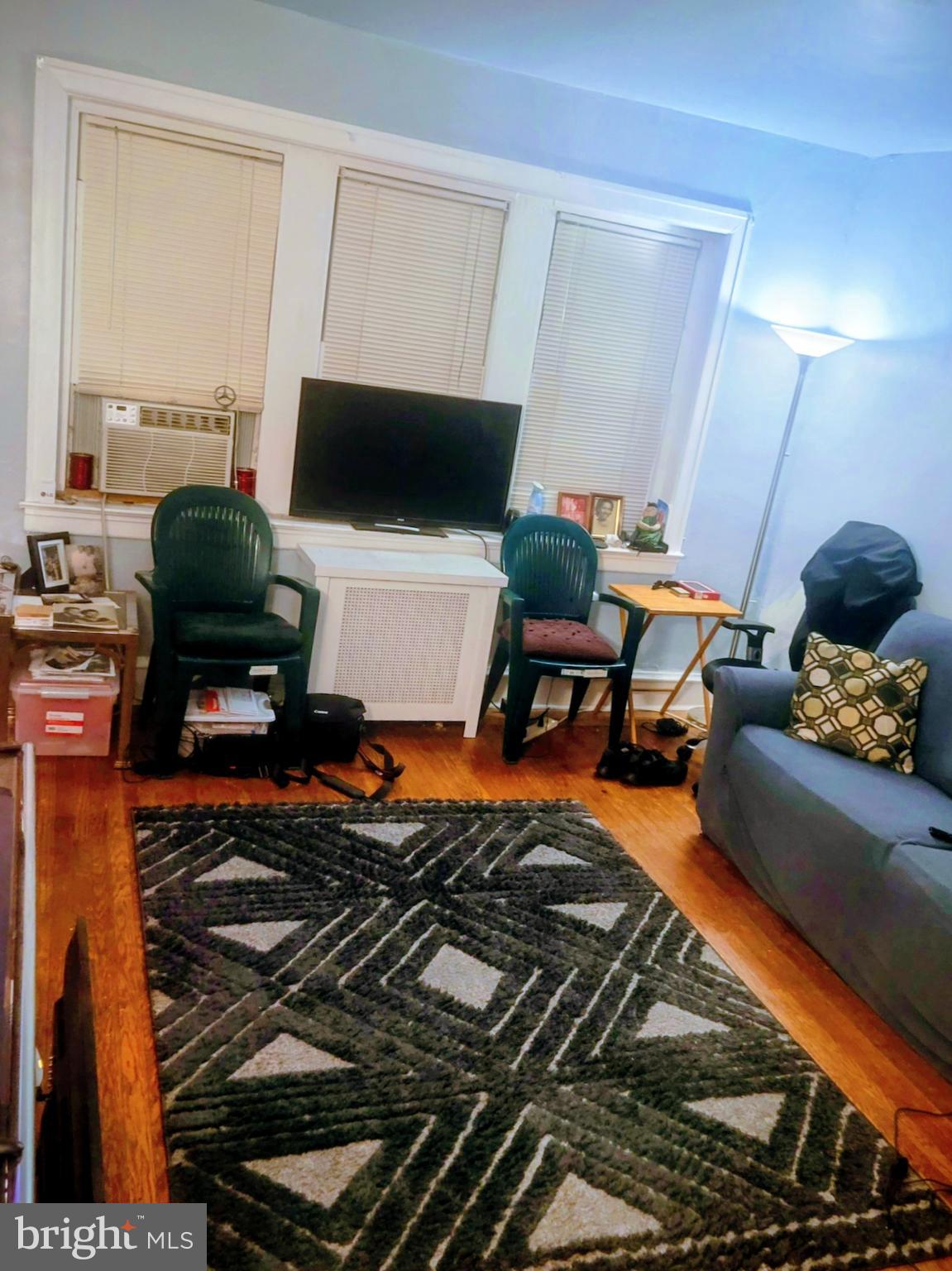 6138 Wayne Avenue, Unit 2 Philadelphia, PA 19144 - Photo 6 of 22 a living room with furniture and a flat screen tv