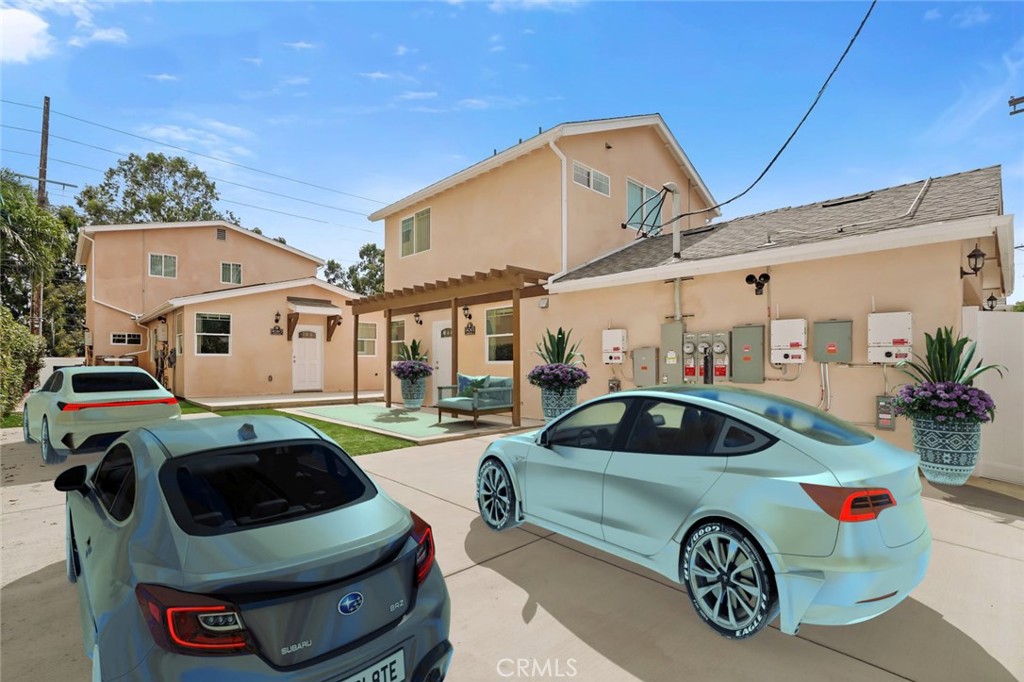 14243 Magnolia Boulevard Sherman Oaks, CA 91423 - Photo 4 of 8 a car parked in front of a white house