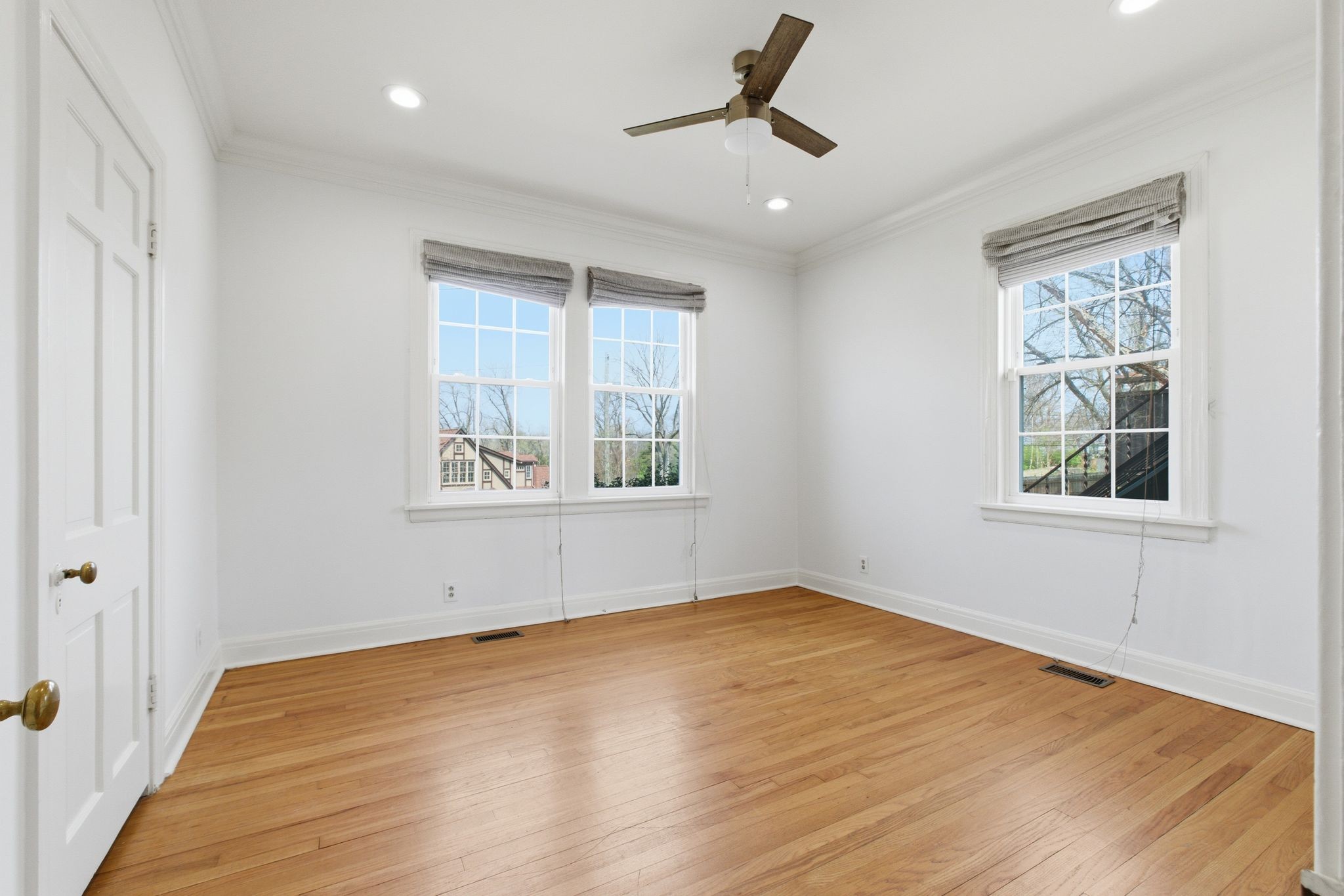 1002 Sutton Hill Road Nashville, TN 37204 - Photo 12 of 34 a view of empty room with wooden floor and fan