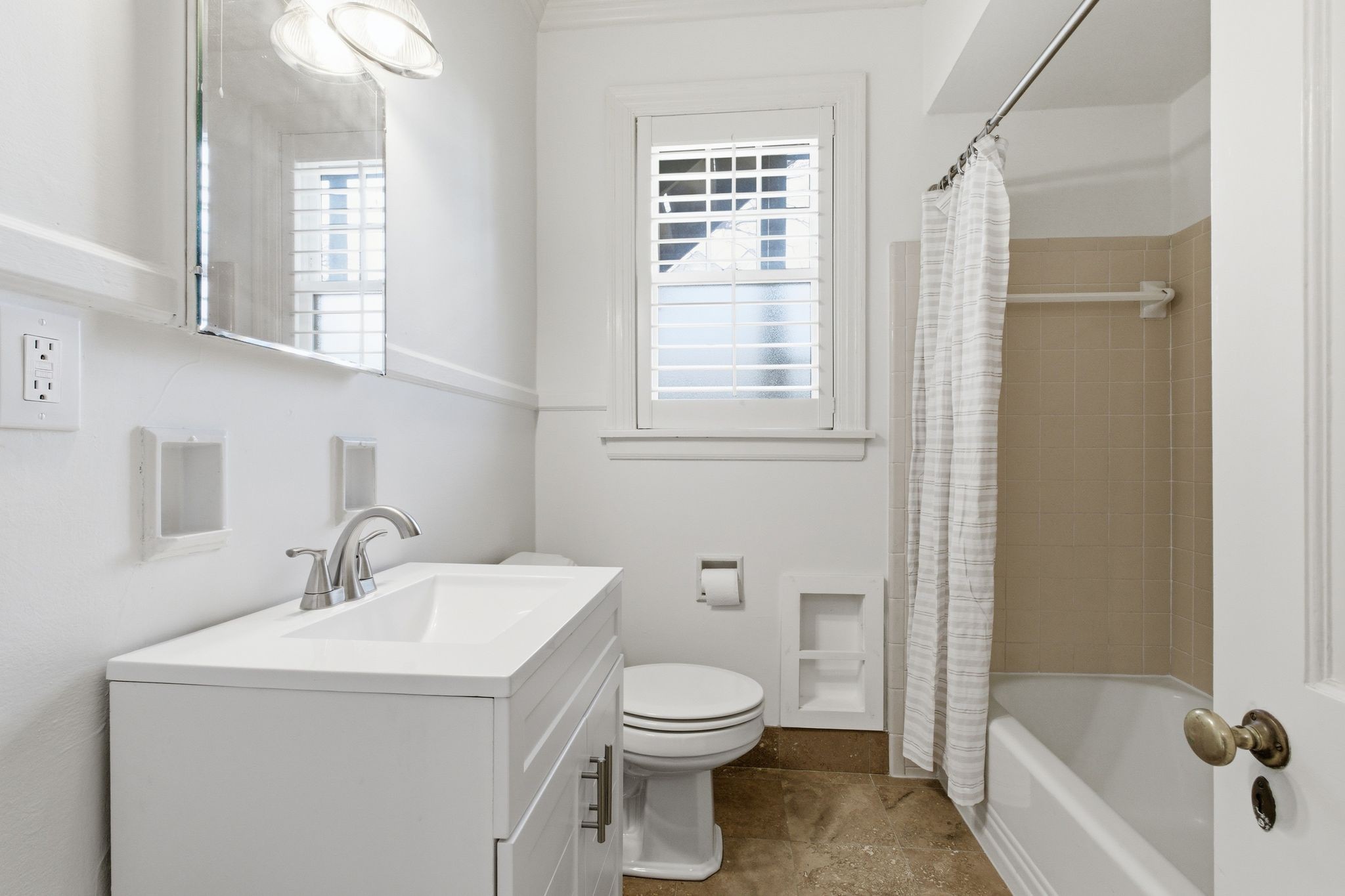 1002 Sutton Hill Road Nashville, TN 37204 - Photo 14 of 34 a bathroom with a sink a toilet and shower