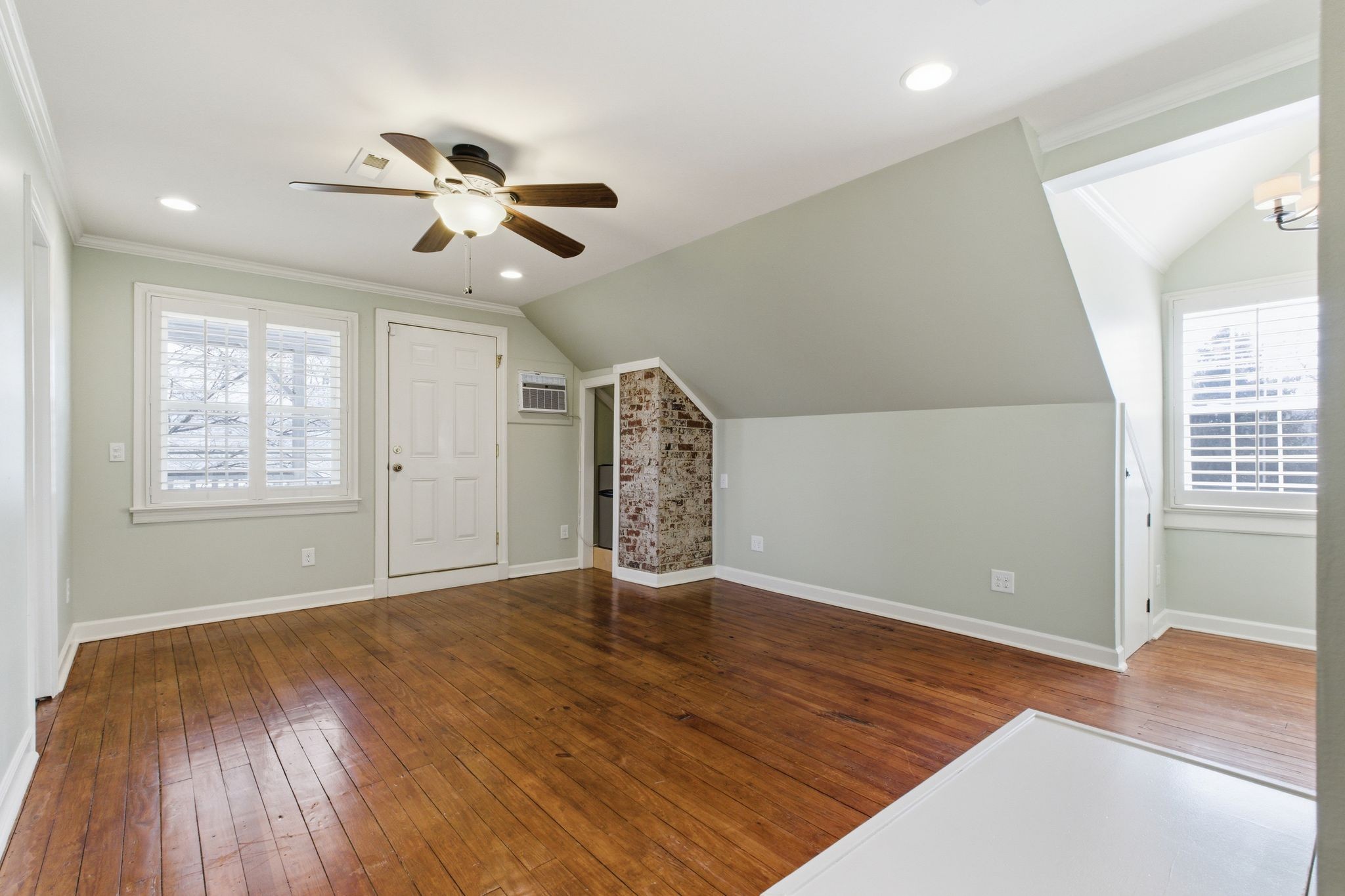 1002 Sutton Hill Road Nashville, TN 37204 - Photo 16 of 34 wooden floor in an empty room with a window