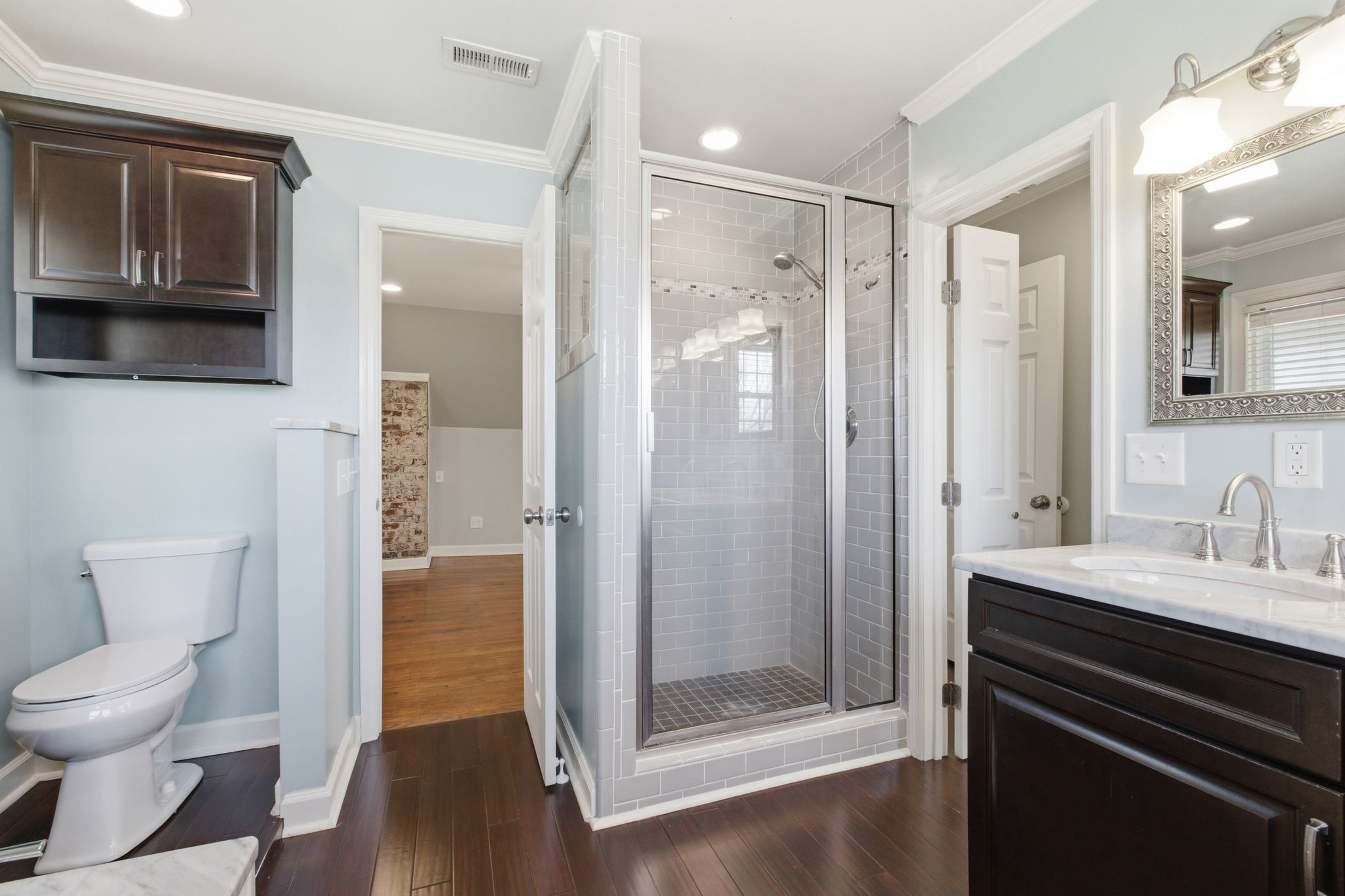 1002 Sutton Hill Road Nashville, TN 37204 - Photo 19 of 34 a bathroom with a sink and a mirror