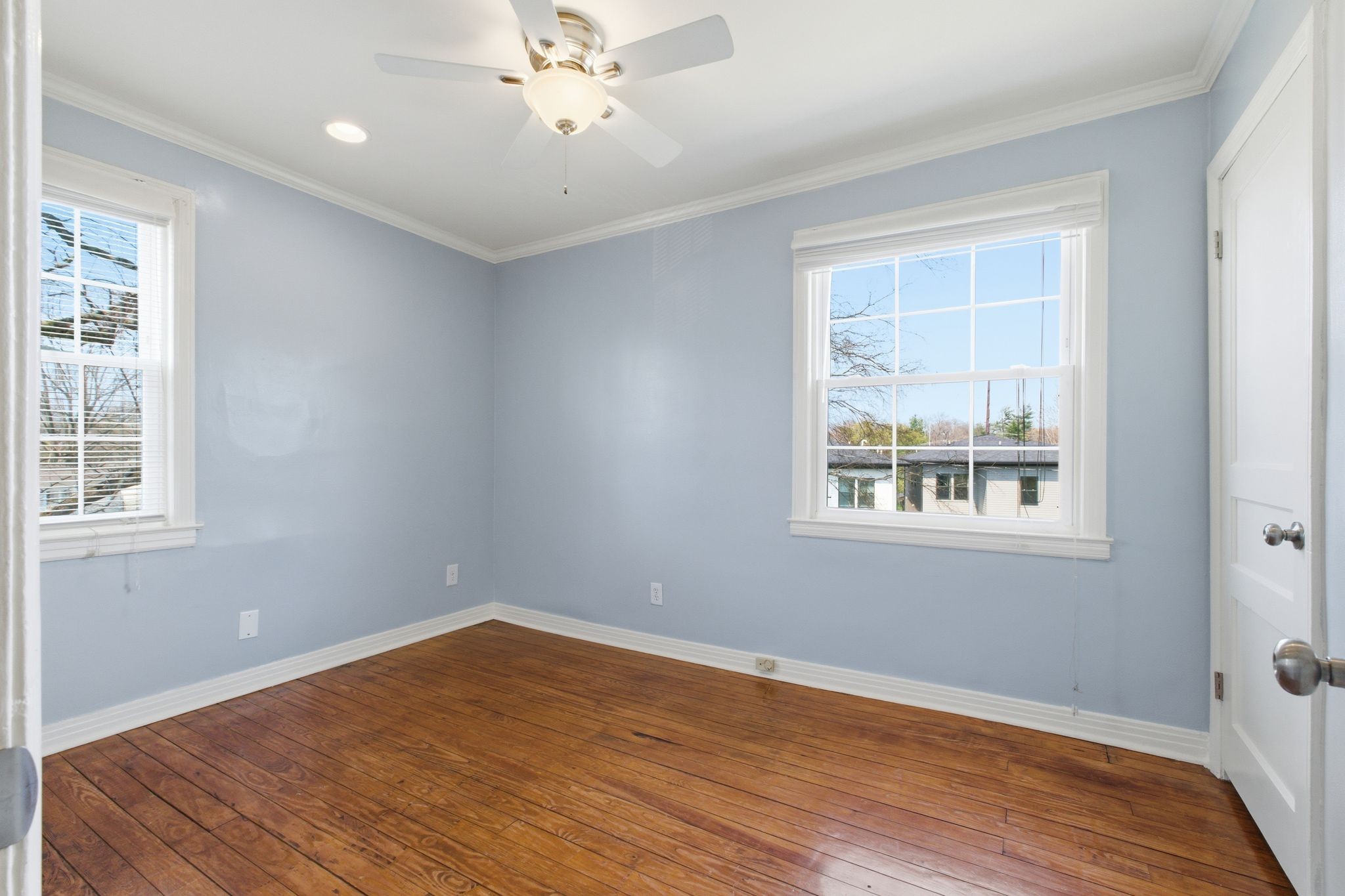 1002 Sutton Hill Road Nashville, TN 37204 - Photo 22 of 34 a view of an empty room with wooden floor and a window