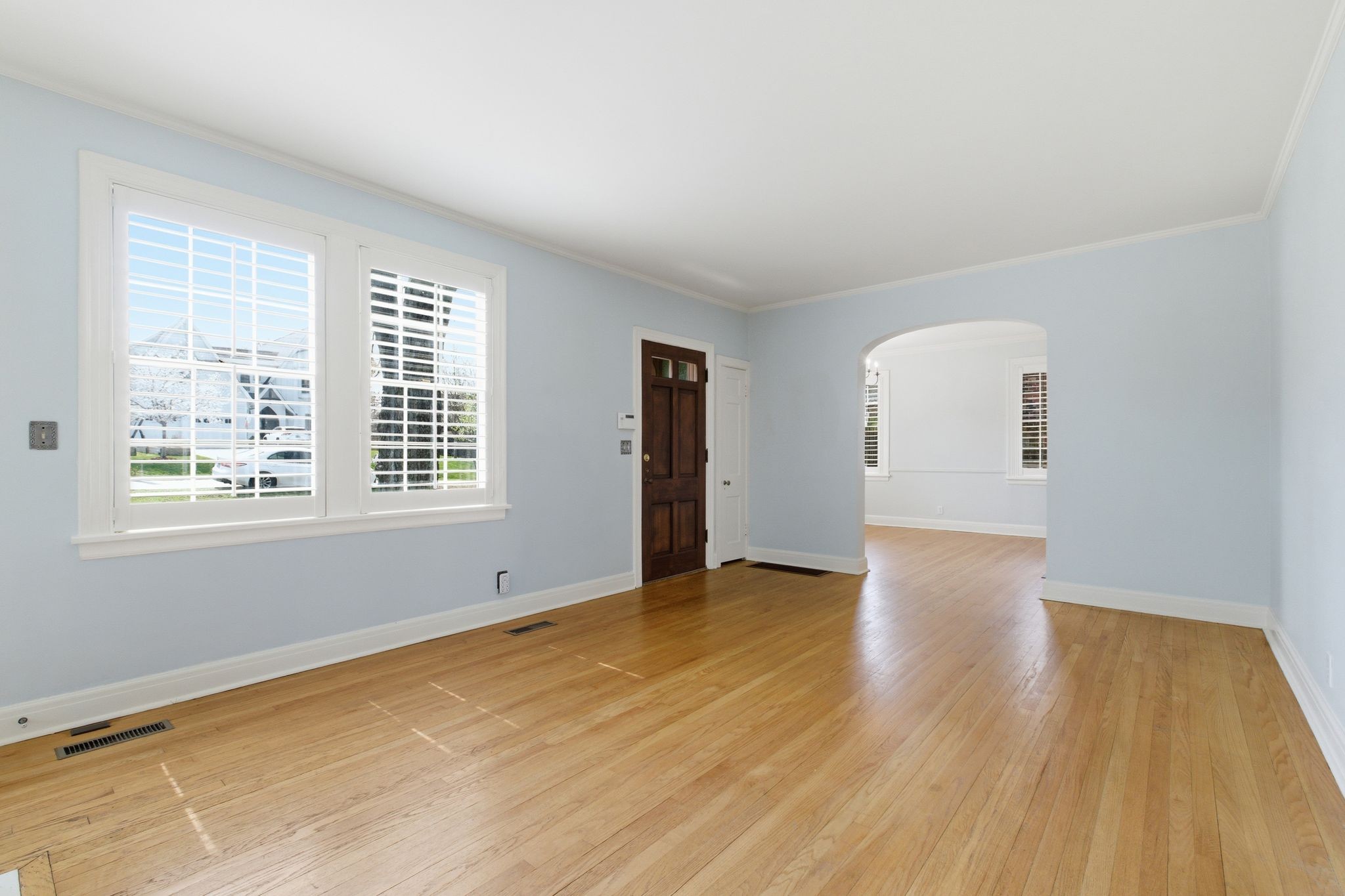 1002 Sutton Hill Road Nashville, TN 37204 - Photo 4 of 34 a view of an empty room with wooden floor and a window