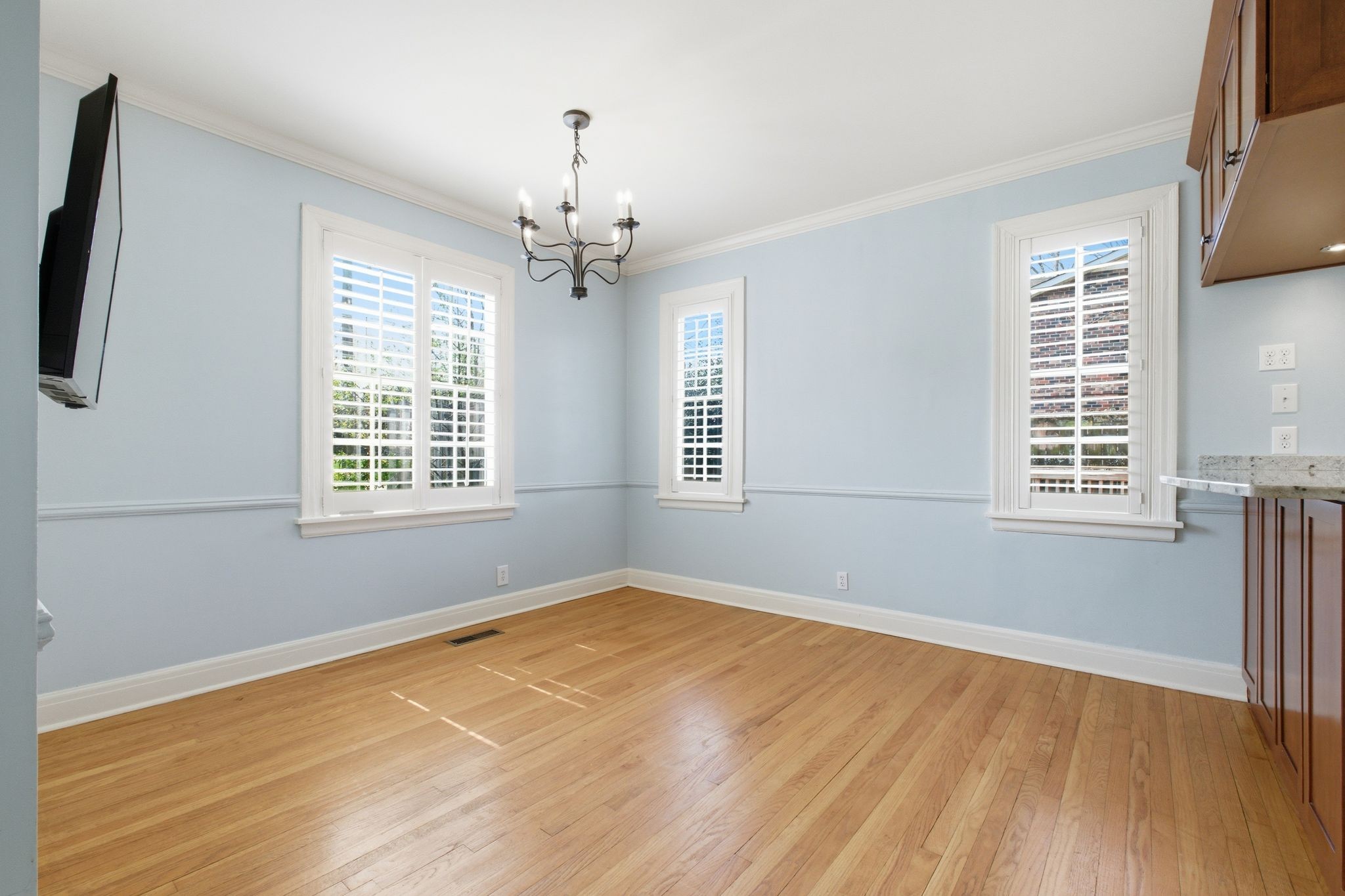 1002 Sutton Hill Road Nashville, TN 37204 - Photo 5 of 34 a view of empty room with wooden floor and fan