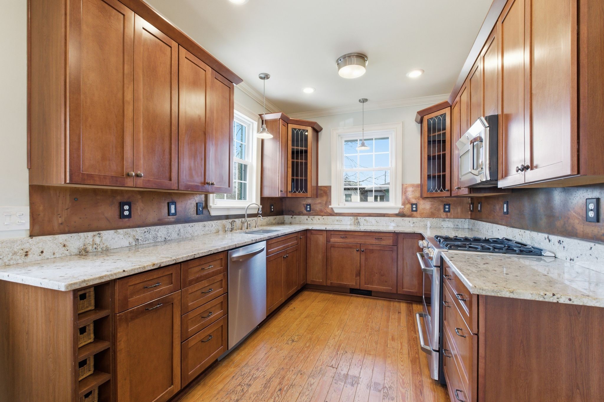 1002 Sutton Hill Road Nashville, TN 37204 - Photo 8 of 34 a kitchen with stainless steel appliances granite countertop wooden cabinets a sink and dishwasher a oven with wooden floor