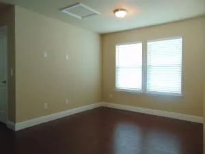 a bathroom with a granite countertop toilet a sink and a mirror