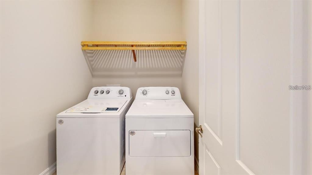 127 Ibiza Loop Venice, FL 34292 - Photo 16 of 20 a utility room with dryer and washer