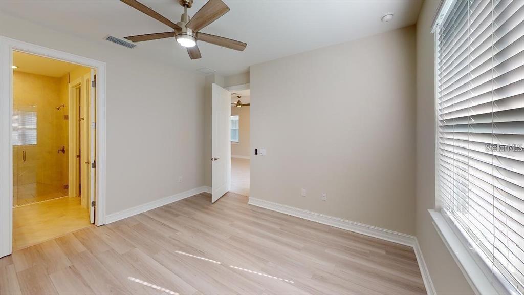 127 Ibiza Loop Venice, FL 34292 - Photo 10 of 20 wooden floor in an empty room with a window