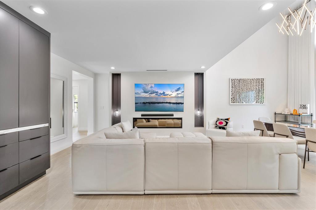 9 Tahoe Lane Sea Ranch Lakes, FL 33308 - Photo 11 of 99 a living room with furniture and a large window