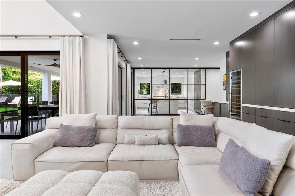 9 Tahoe Lane Sea Ranch Lakes, FL 33308 - Photo 12 of 99 a living room with furniture and a view of kitchen