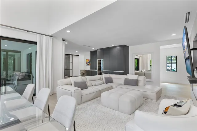 a dining room with furniture and a window