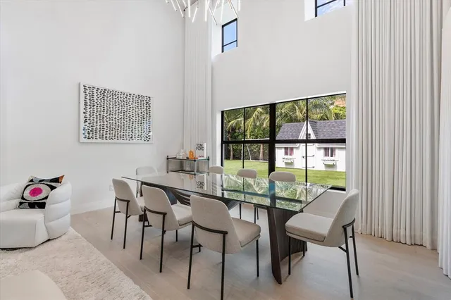 a view of a kitchen with furniture and floor to ceiling window