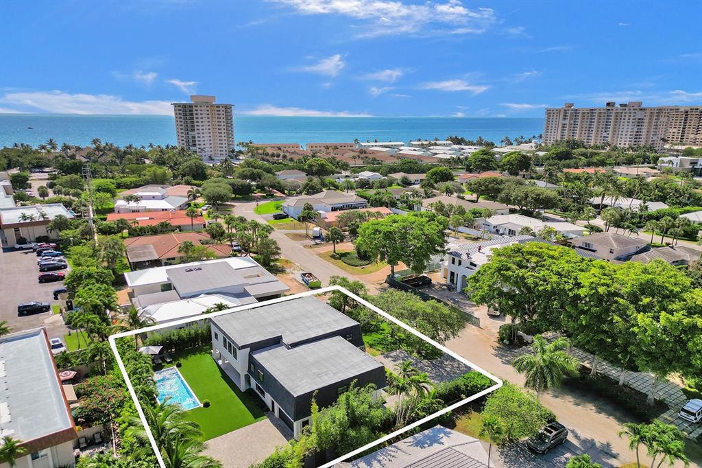 9 Tahoe Lane Sea Ranch Lakes, FL 33308 - Photo 2 of 99 an aerial view of a house with a garden