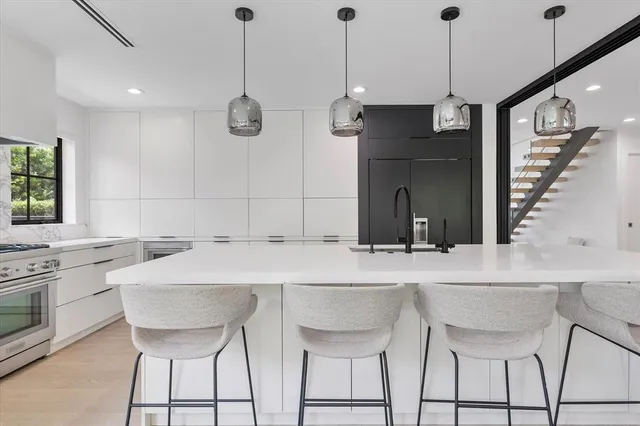 a bedroom with a large bed and a flat screen tv