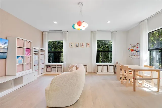 a spacious bedroom with a bed and a couch