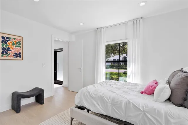 a bed room with furniture and a window