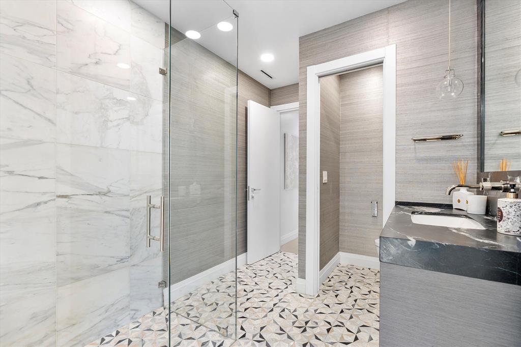 9 Tahoe Lane Sea Ranch Lakes, FL 33308 - Photo 35 of 99 a bathroom with a sink and a mirror