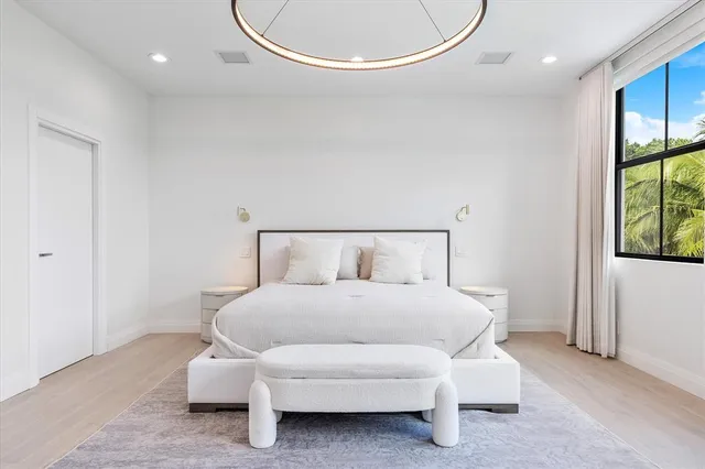 a large brick building with a big yard and large trees