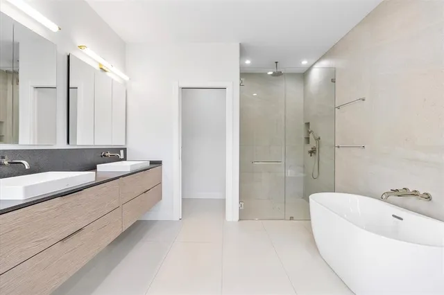 a front view of a house with a garden and plants