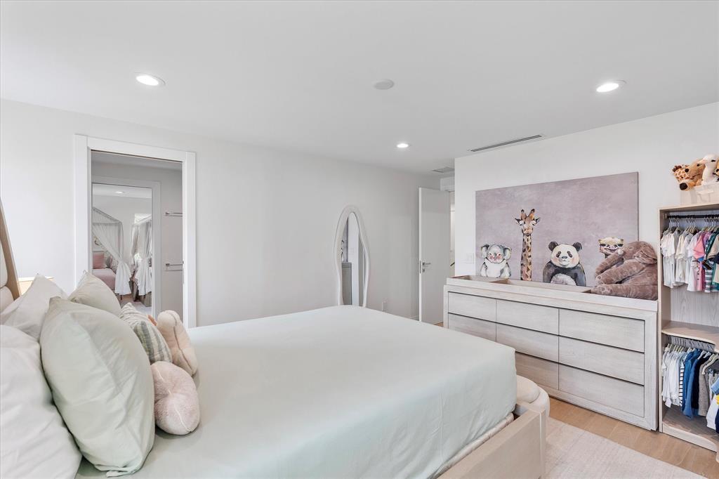 9 Tahoe Lane Sea Ranch Lakes, FL 33308 - Photo 50 of 99 a bedroom with a bed and walk in closet