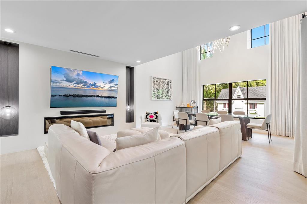 9 Tahoe Lane Sea Ranch Lakes, FL 33308 - Photo 9 of 99 a living room with furniture and a flat screen tv