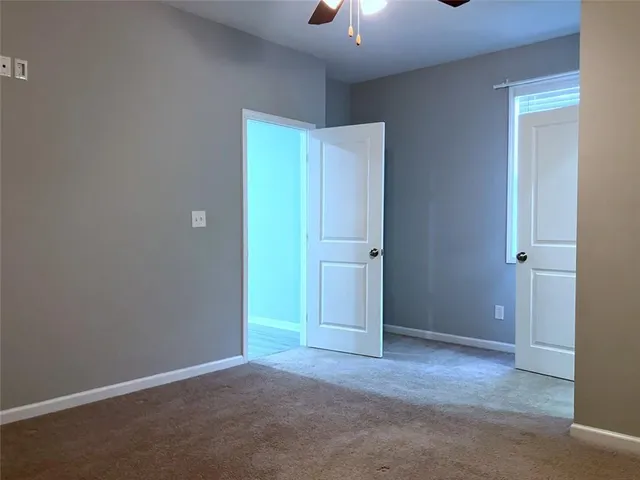 a bath tub sitting in a bathroom next to a window
