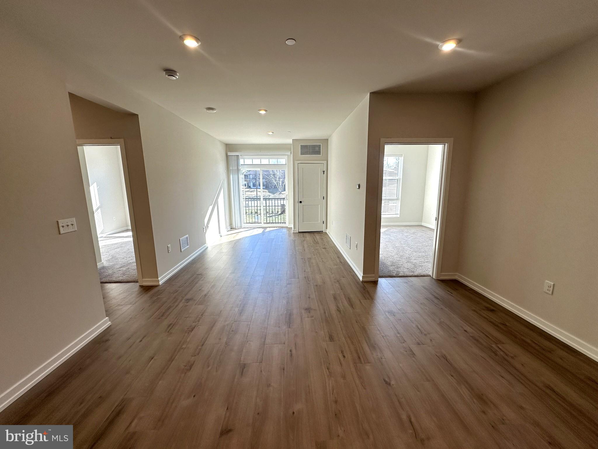 409 West Butler Avenue, Unit 223 Chalfont, PA 18914 - Photo 12 of 33 an empty room with wooden floor and windows