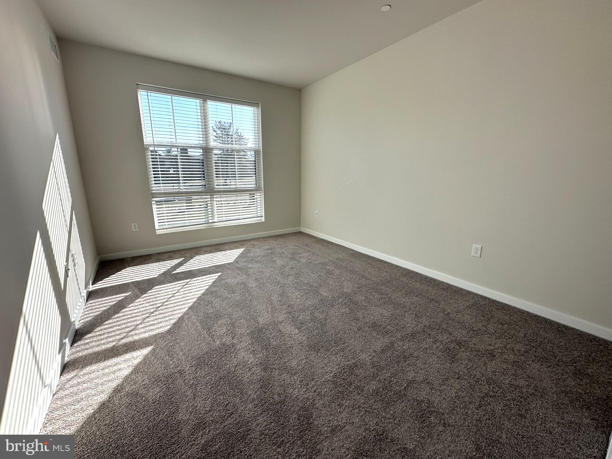 409 West Butler Avenue, Unit 223 Chalfont, PA 18914 - Photo 14 of 33 a view of an empty room with a window