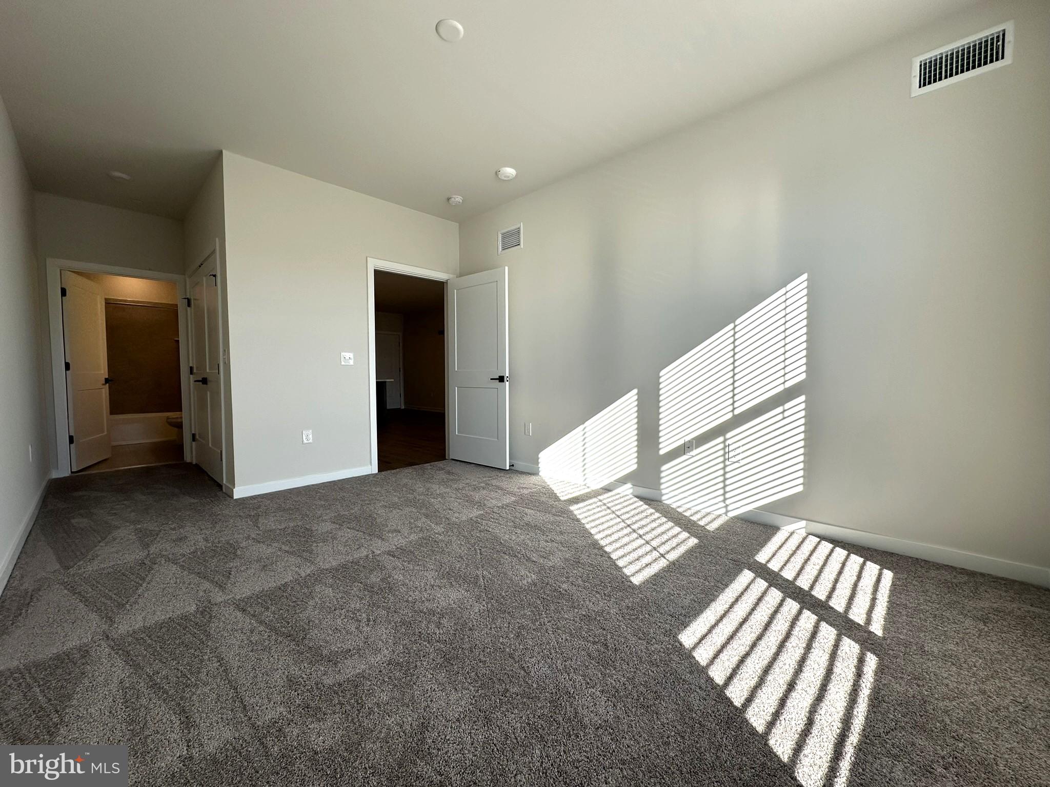 409 West Butler Avenue, Unit 223 Chalfont, PA 18914 - Photo 15 of 33 a view of an empty room and window