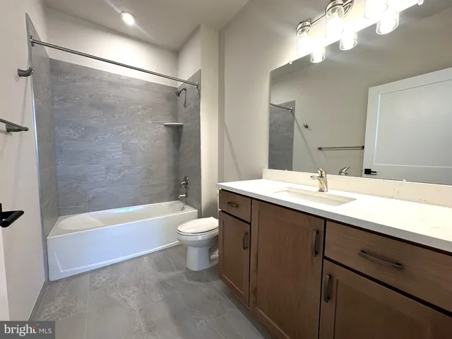 a bathroom with a sink a toilet and a bathtub