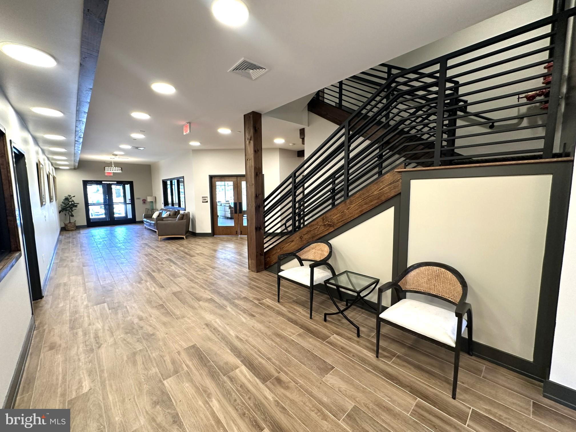 409 West Butler Avenue, Unit 223 Chalfont, PA 18914 - Photo 3 of 33 a view of an entryway with wooden floor