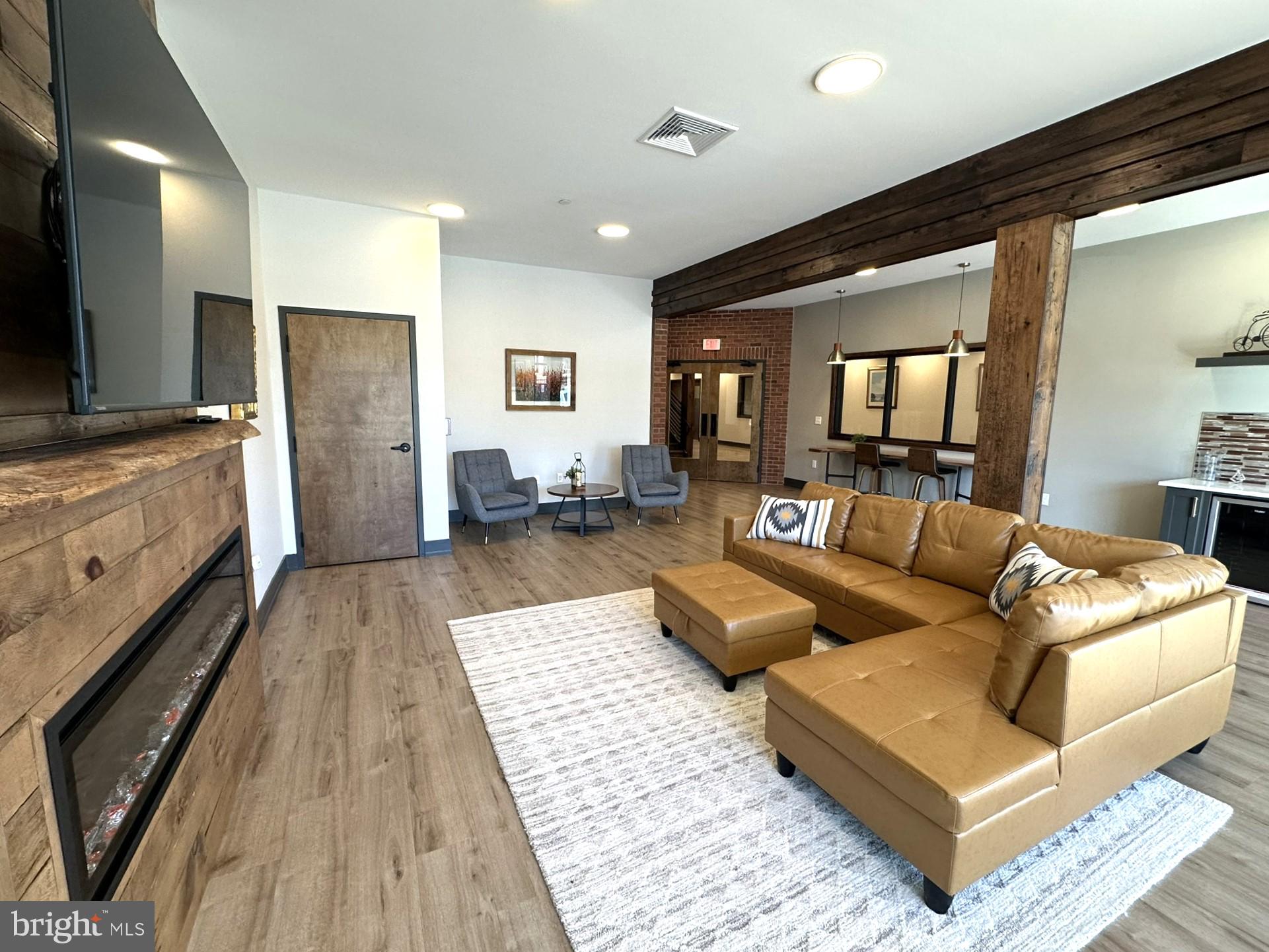 409 West Butler Avenue, Unit 223 Chalfont, PA 18914 - Photo 31 of 33 a living room with furniture and a rug