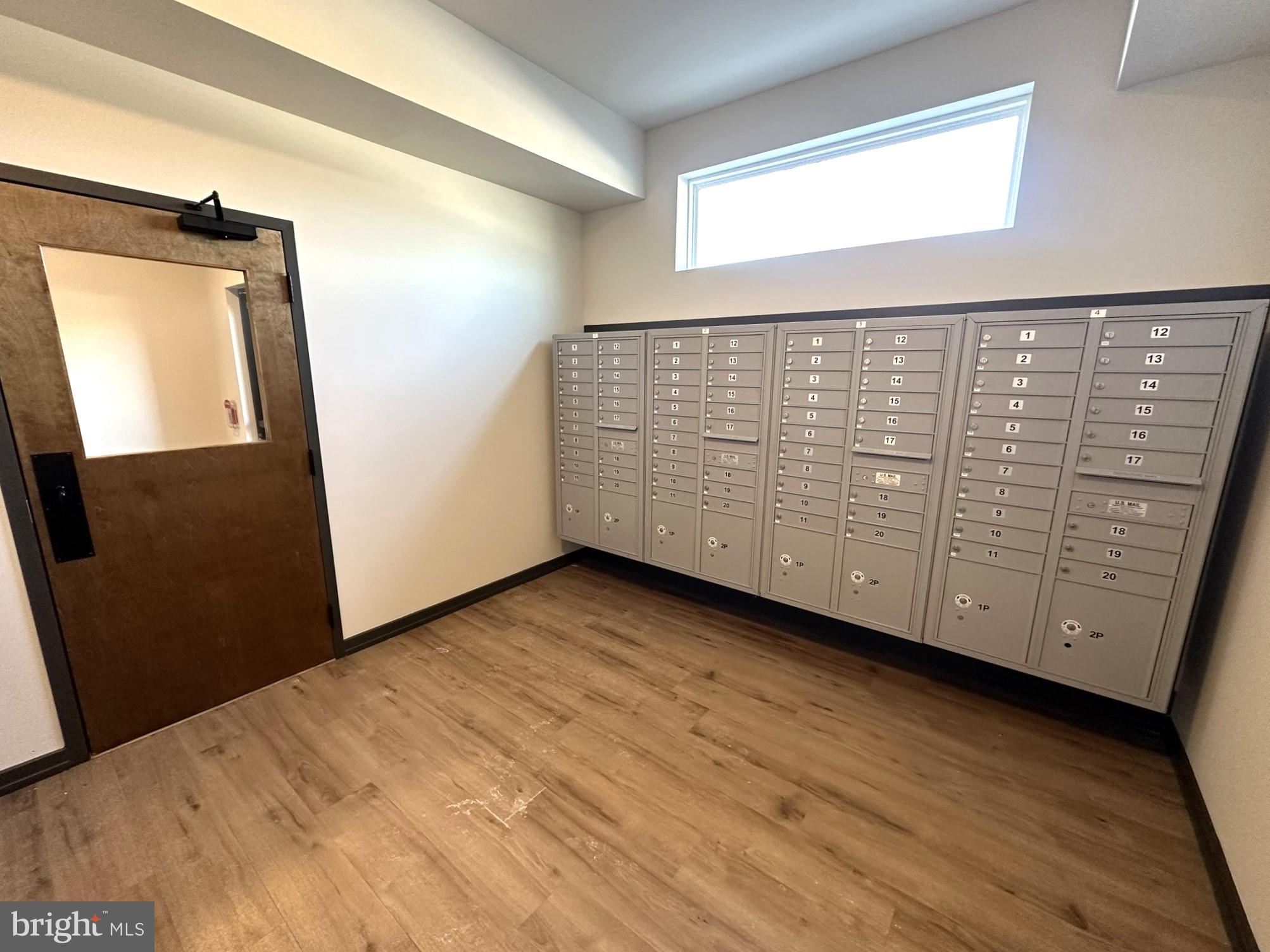 409 West Butler Avenue, Unit 223 Chalfont, PA 18914 - Photo 33 of 33 a view of an empty room with wooden floor