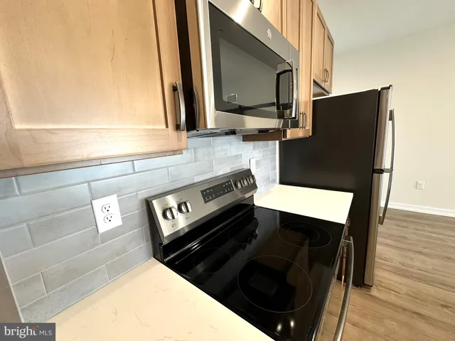 a close view of a sink and a microwave oven