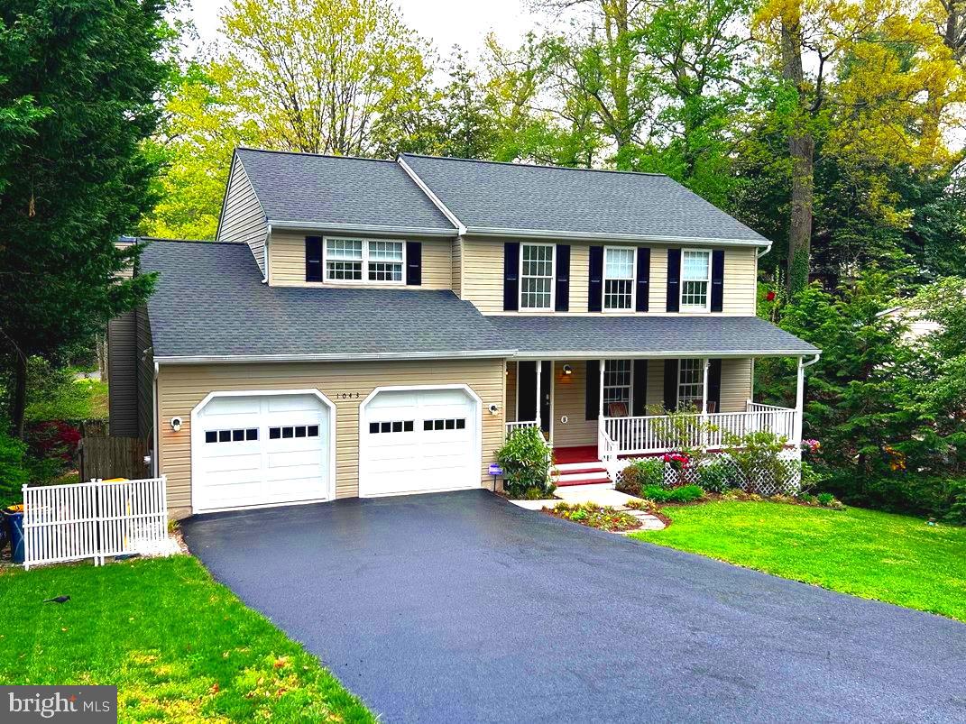 a aerial view of a house with a yard and a table and chairs