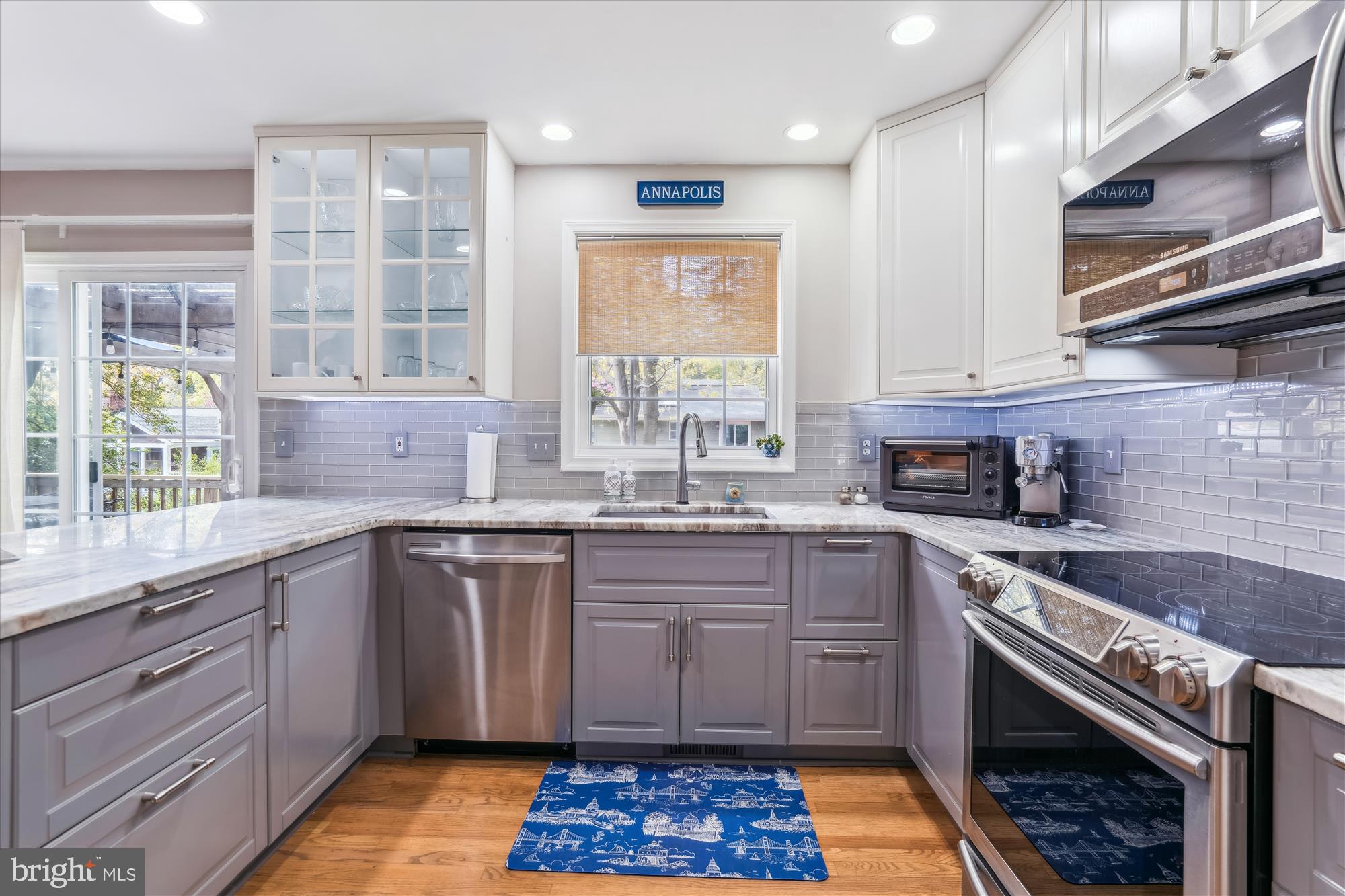 1043 Skyview Drive Annapolis, MD 21409 - Photo 12 of 71 a kitchen with stainless steel appliances granite countertop a stove a sink and a microwave