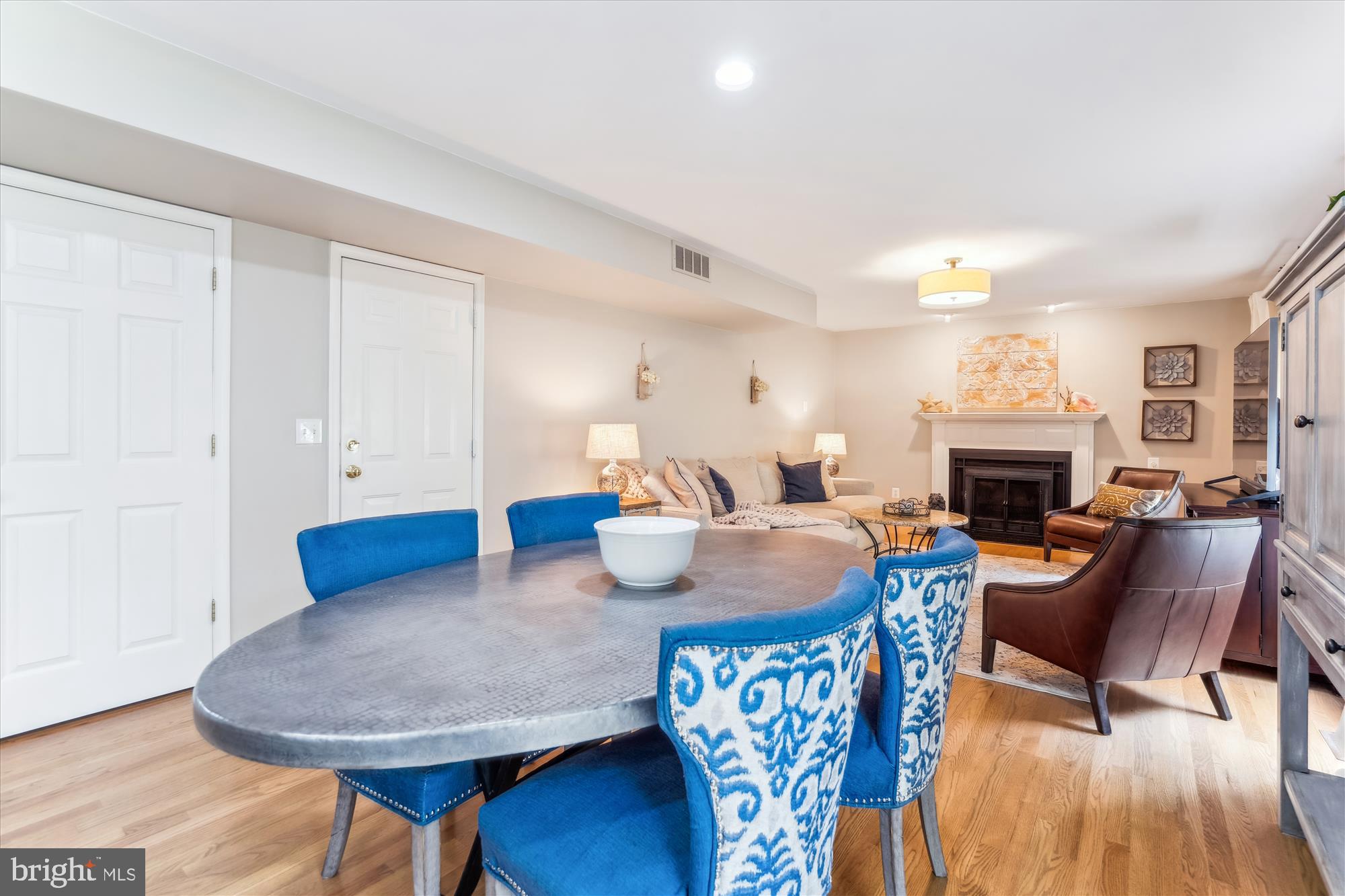 1043 Skyview Drive Annapolis, MD 21409 - Photo 14 of 71 a living room with furniture a fireplace and a table