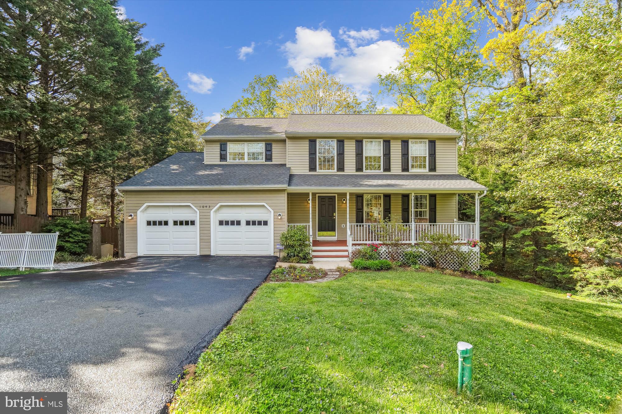 1043 Skyview Drive Annapolis, MD 21409 - Photo 2 of 71 a front view of a house with a yard and garage