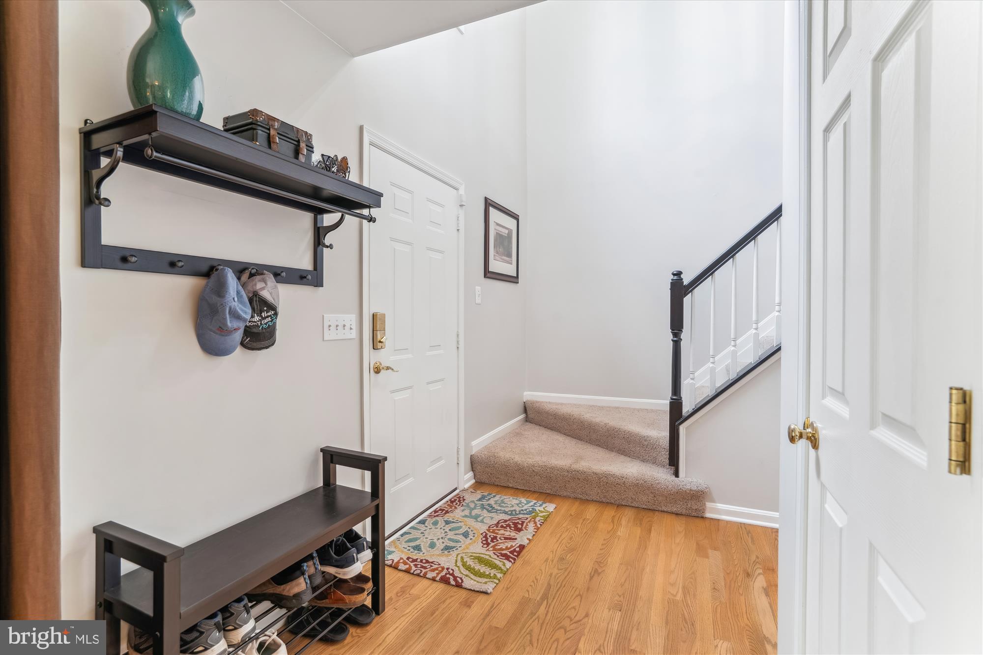 1043 Skyview Drive Annapolis, MD 21409 - Photo 33 of 71 a view of a hallway with wooden floor and staircase