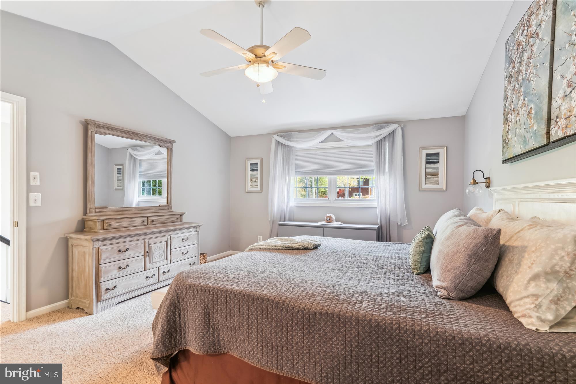 1043 Skyview Drive Annapolis, MD 21409 - Photo 35 of 71 a bedroom with a large bed and a chandelier