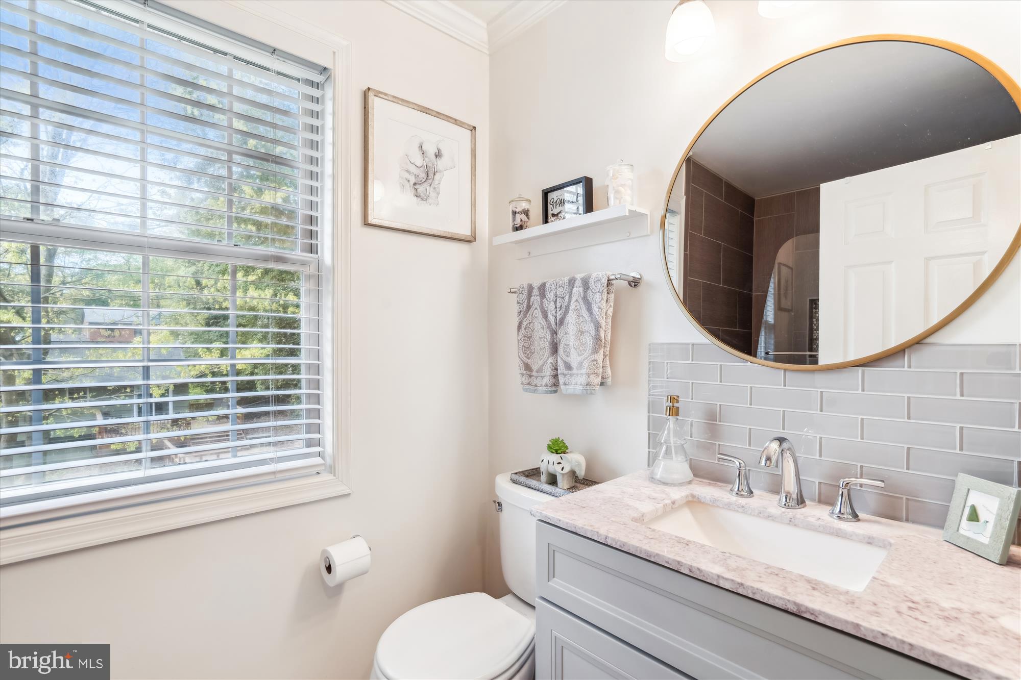 1043 Skyview Drive Annapolis, MD 21409 - Photo 42 of 71 a bathroom with a granite countertop toilet sink and mirror